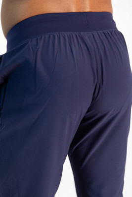 Le pantalon extensible UA Woven