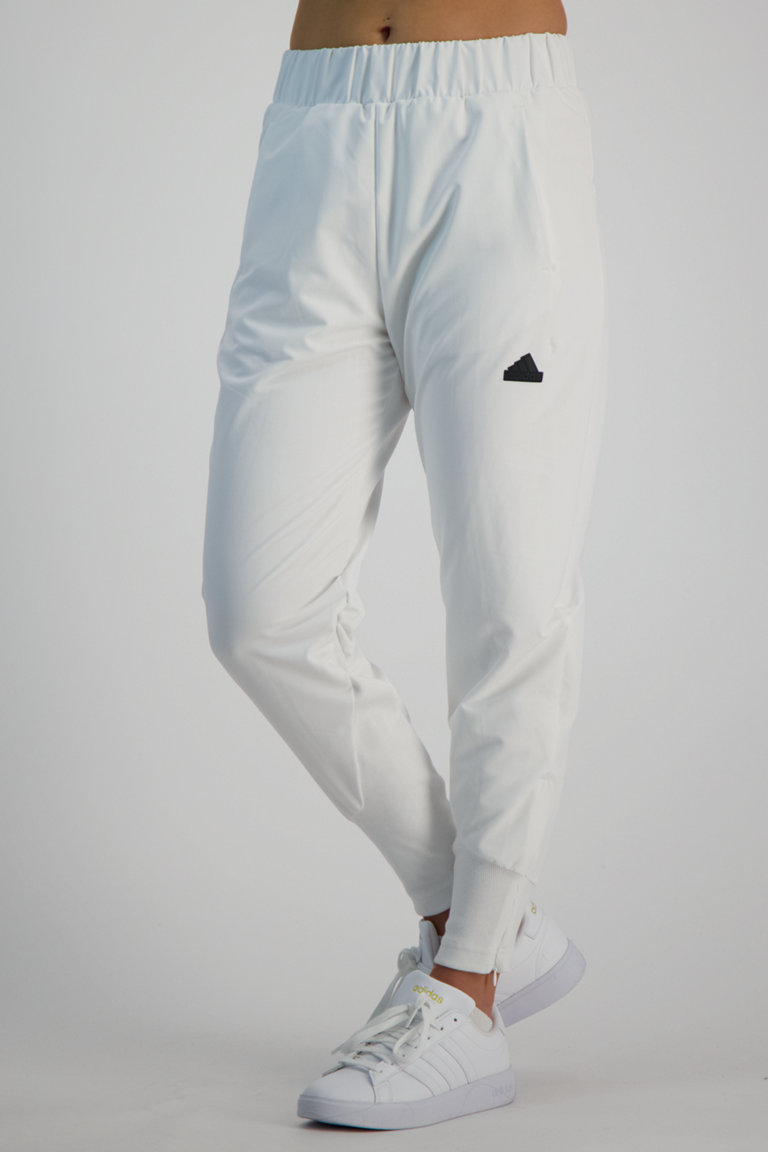 Compra Z.N.E. Woven pantaloni della tuta donna adidas Sportswear in bianco ochsnersport.ch